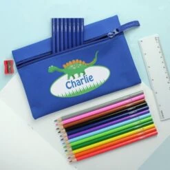Blue Dinosaur Pencil Case With Personalised Pencils & Crayons